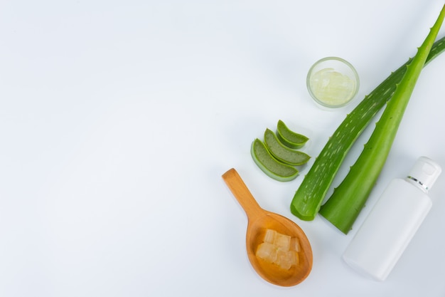 Free photo aloe vera fresh leaves with slices and gel on wooden spoon. aloe vera is natural herb use for beauty.