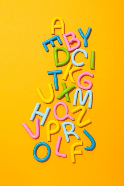 Free Photo alphabet made of colored plasticine on a light background