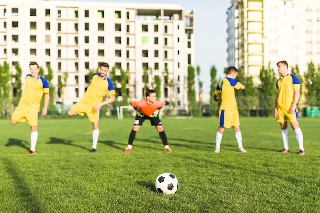 Amateur football concept with team stretching