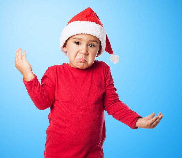 Amazed kid with blue background