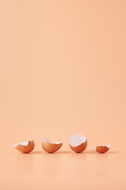 Amazing shot of eggshell isolated on orange background