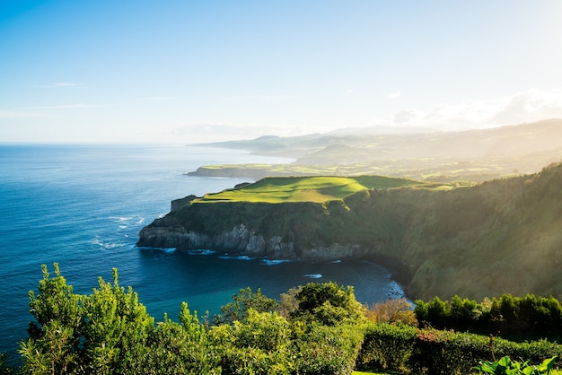 Amazing view of a green cliff near the sea in the Azores archipelago, Portugal