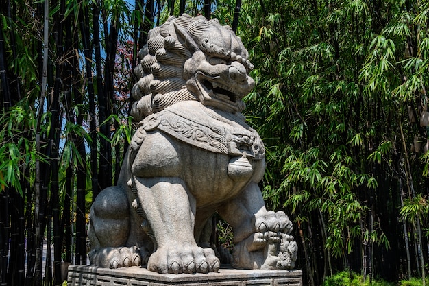 Amazing view of a stone sculpture of a big lion located in the Gardens by the Bay in Singapore