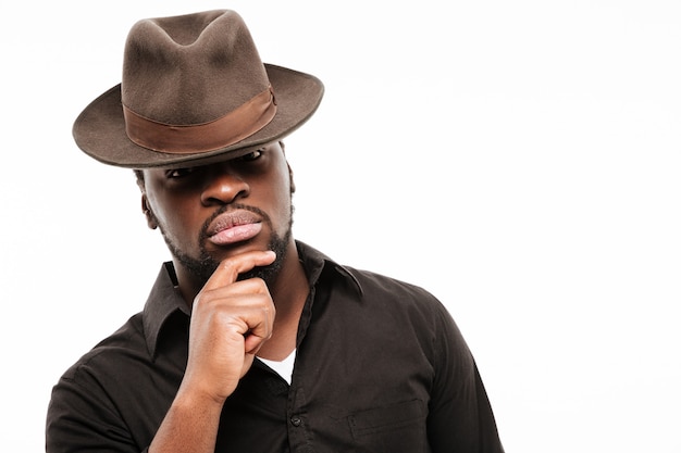 Amazing young man dressed in shirt wearing hat