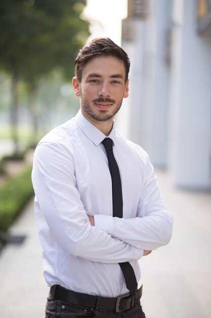 Ambitious businessman standing in street