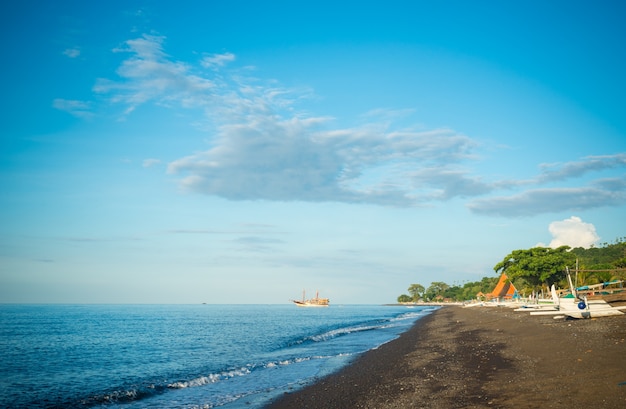 Amed black sand beach