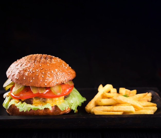 Free photo american burger ready to be served with fries