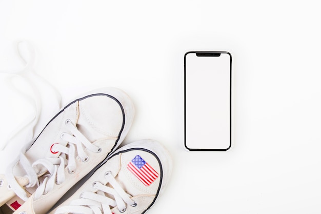 Free Photo american flag on shoe next to smarrtphone