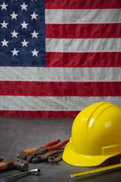 American flag and tools near the helmet Labor day concept.