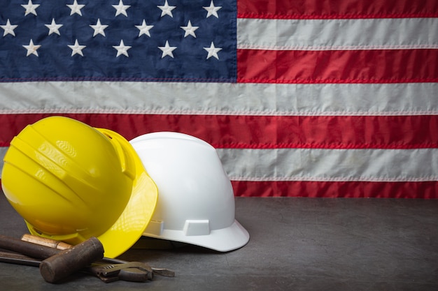 American flag and tools near the helmet Labor day concept.