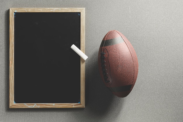 Free photo american football ball and blackboard