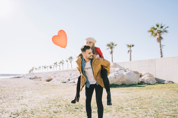 Free photo amorous couple on sunny shoreline