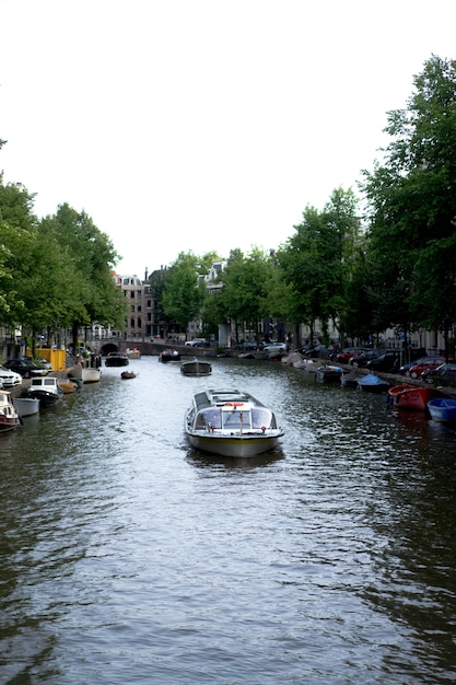 Free photo amsterdam canals, boats walk on water