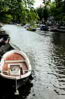 Free photo amsterdam canals, boats walk on water