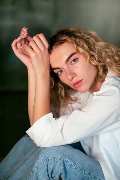 Analog portrait of beautiful woman posing artistically indoors