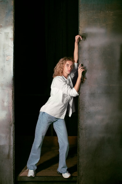 Free photo analog portrait of beautiful woman posing artistically indoors