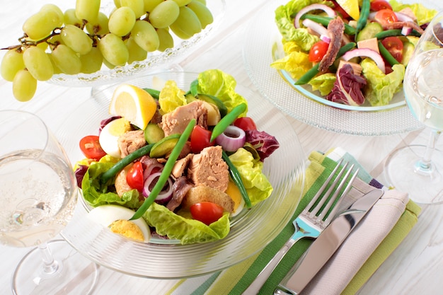 Anchovies and tuna salad in a glass bowl