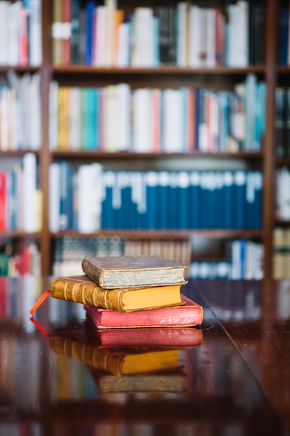 Free photo ancient books on library table