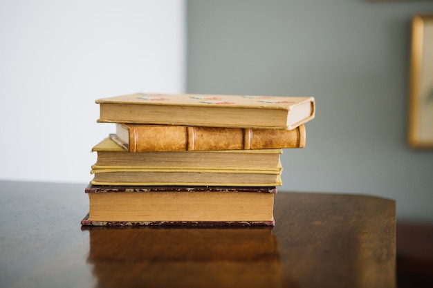 Free Photo ancient books on wooden cabinet