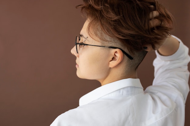 Androgynous teen in stylish clothes