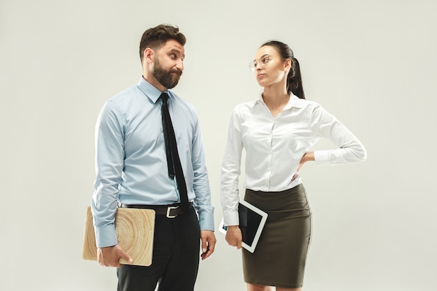 Free photo angry boss. man and his secretary standing at office