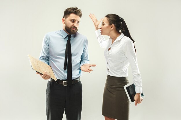 Angry boss. Woman and secretary standing at office 