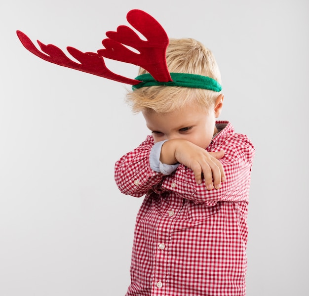 Free photo angry boy with reindeer antlers