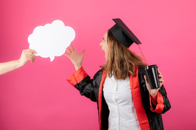 Free Photo angry female student holding a coffee cup and point hand to the idea board. high quality photo