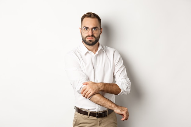 Free Photo angry man roll up sleeves and looking offended, getting ready to fight, standing   