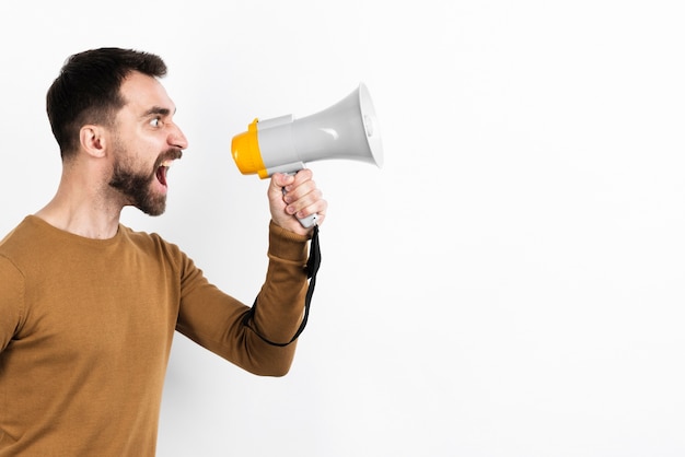 Angry man screaming in megaphone