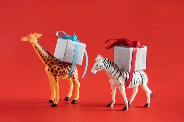 Free photo animals toys carrying present boxes