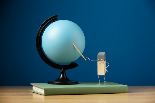 Free photo animated eraser and globe still life