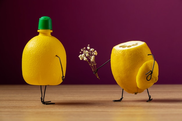 Free photo animated lemon and juice bottle still life