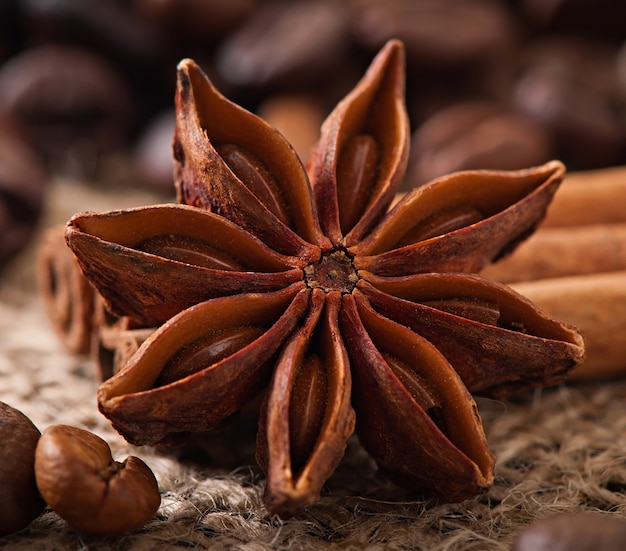 Free Photo anise, cinnamon and coffee beans on old wooden background