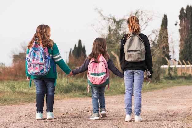 Free Photo anonymous kids walking to school