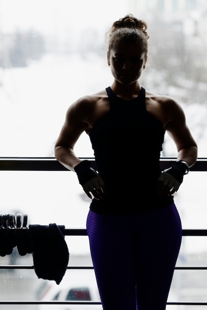 Free Photo anonymous woman resting during training