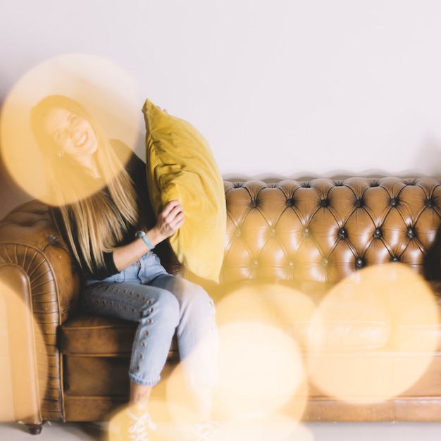 Free photo anonymous woman with pillow