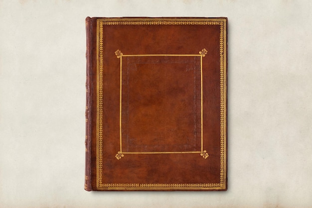 Free photo antique book cover, brown leather with gold details