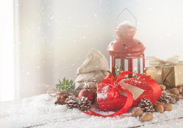 Antique lamp with a red gift with red bow