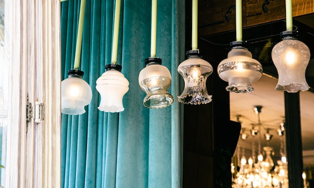 Free photo antique vintage chandeliers with lamps inside retro exterior detail