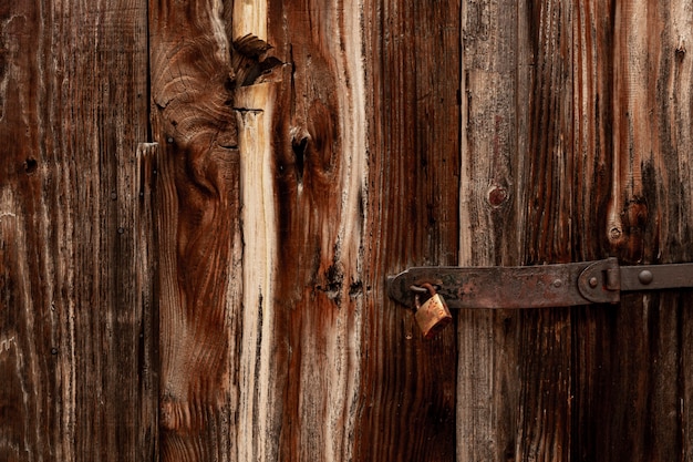 Antique wood with worn surface and metal hinge and lock