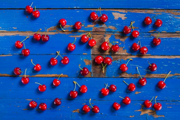 Free Photo antique wooden surface with appetizing cherries