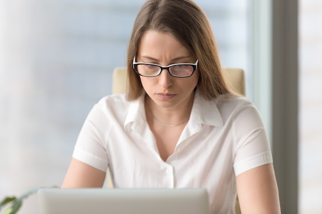 Free Photo anxious confused businesswoman having problem with pc laptop, headshot portrait