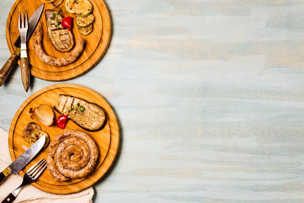 Appetizing portions of garnished grilled spiral sausages