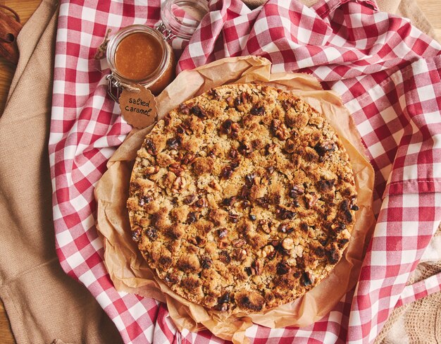 Apple pie topped with crumble and roasted nuts