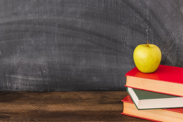 Apple on stack of books