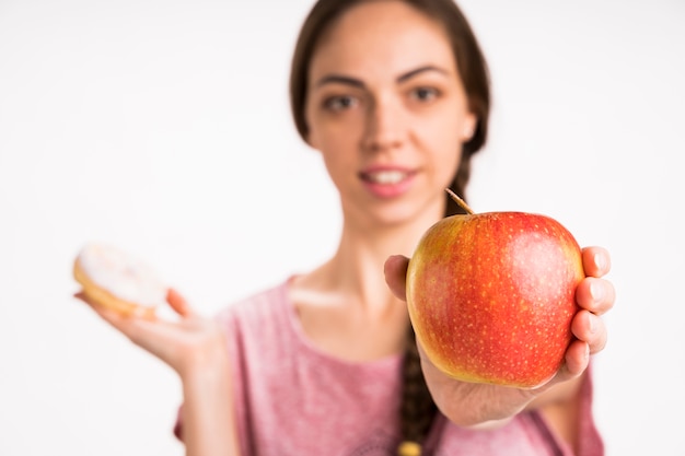 Apple with blurred woman in background