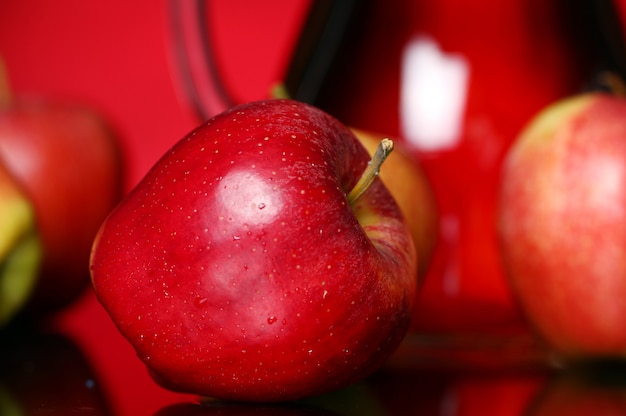 Apples and pitcher with juice