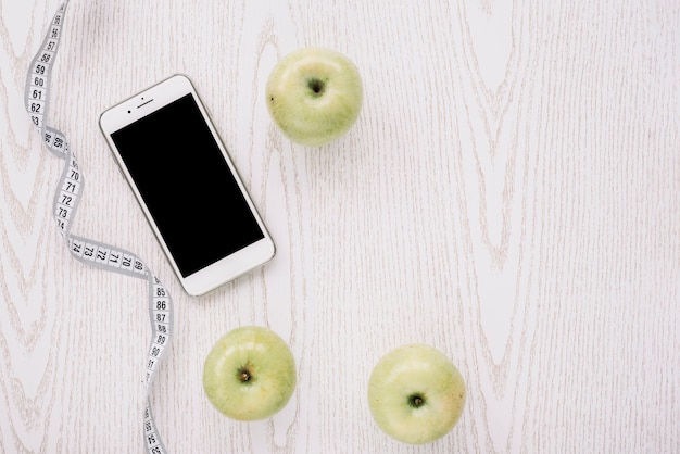 Free photo apples, smartphone and measurement tape