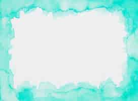 Free photo aquamarine frame of paints on white sheet